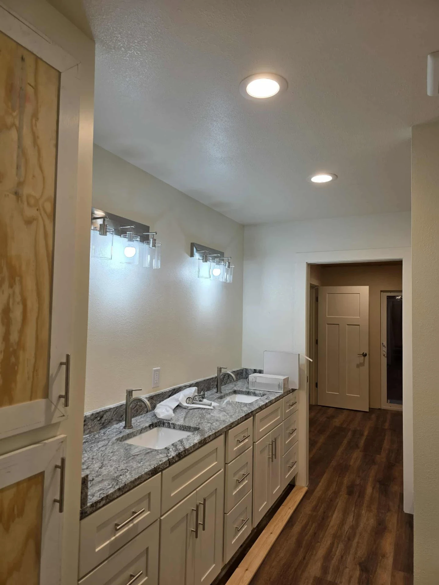 Bathroom vanity with bright modern electrical fixtures